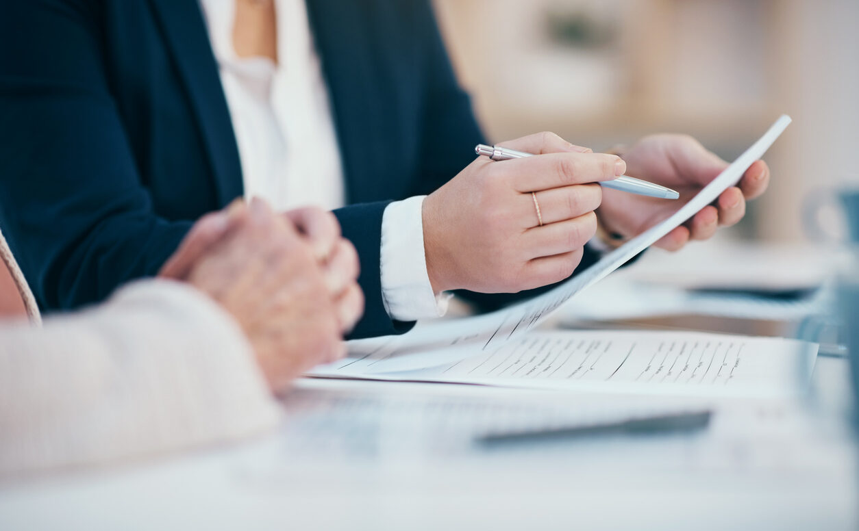 reading and writing on business meeting notes