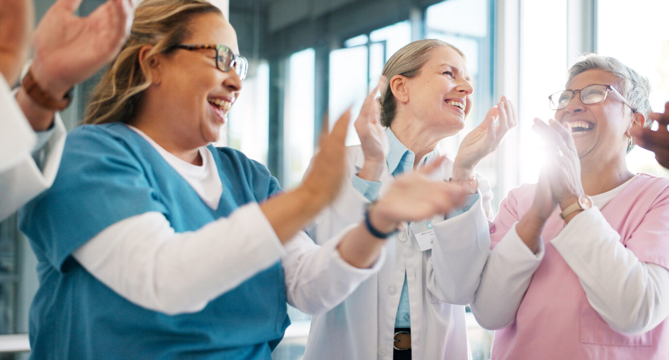 Doctor, support and applause in celebration for team unity