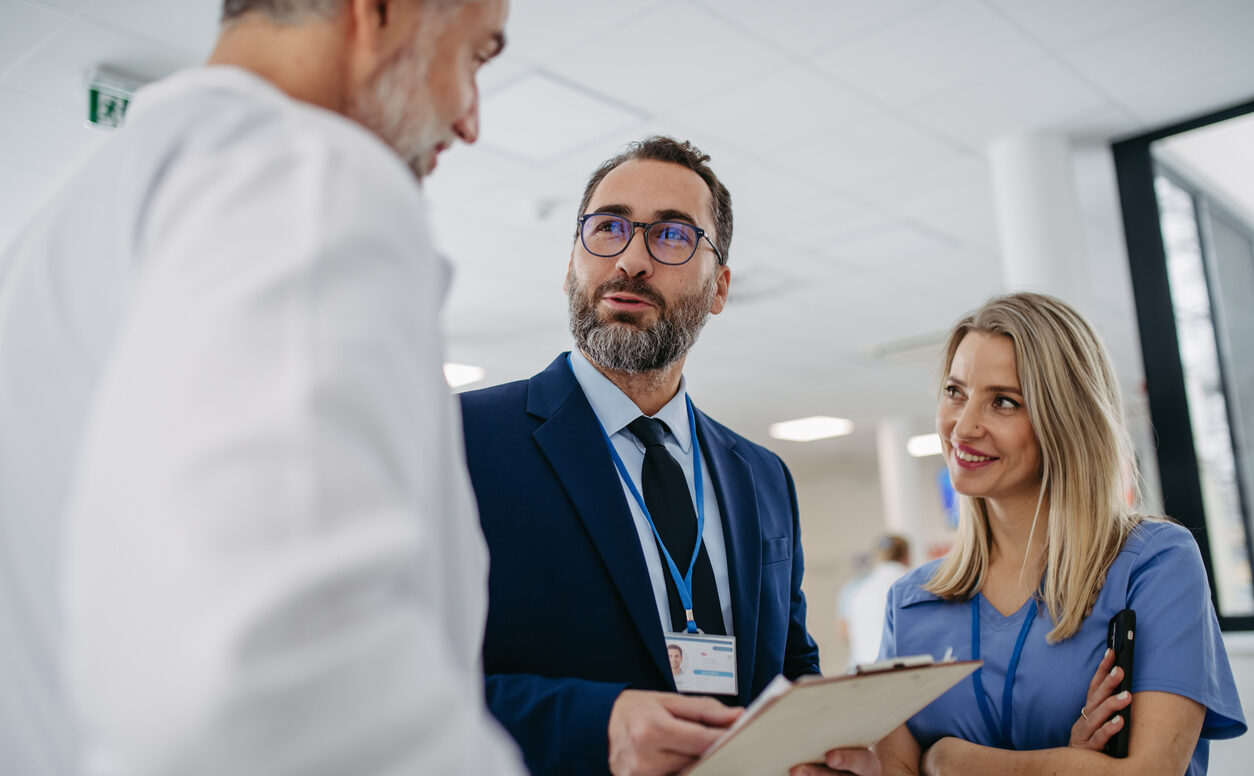 Pharmaceutical sales representative talking with doctors