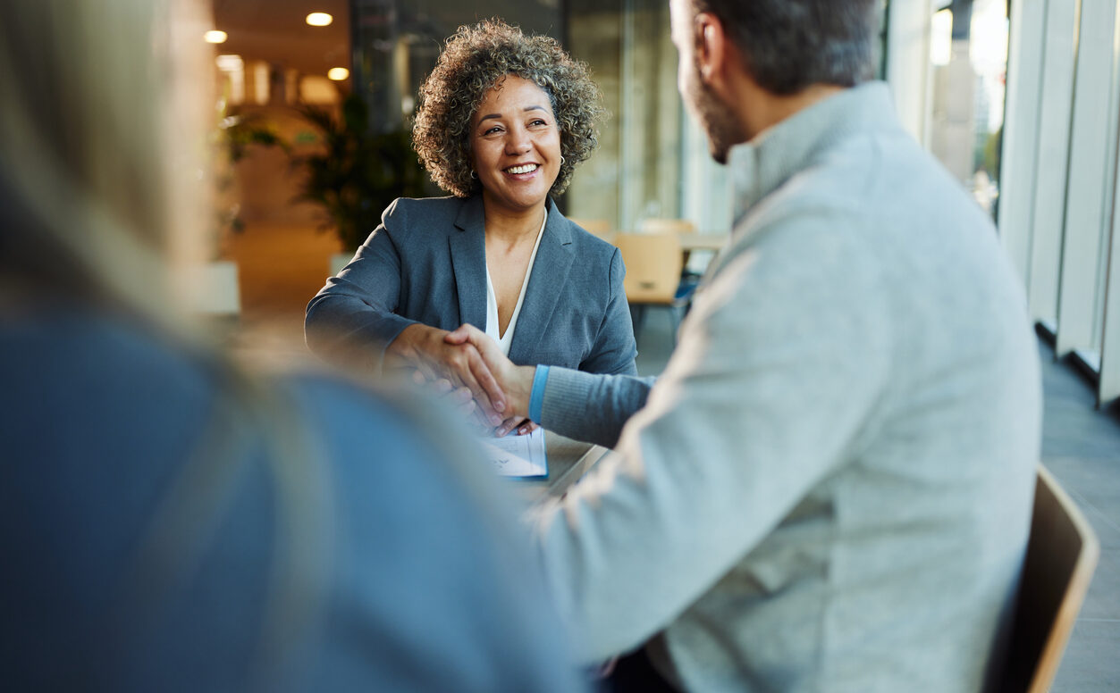 businesswoman came to an agreement with her colleague during a meeting in the office