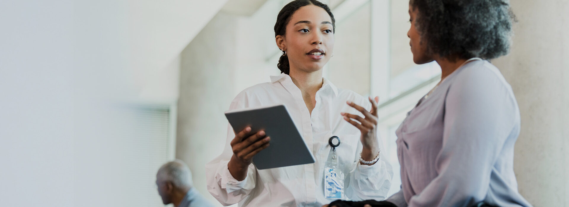 woman speaking with a healthcare patient