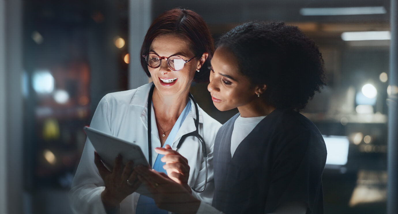 doctor with surgeon on tablet