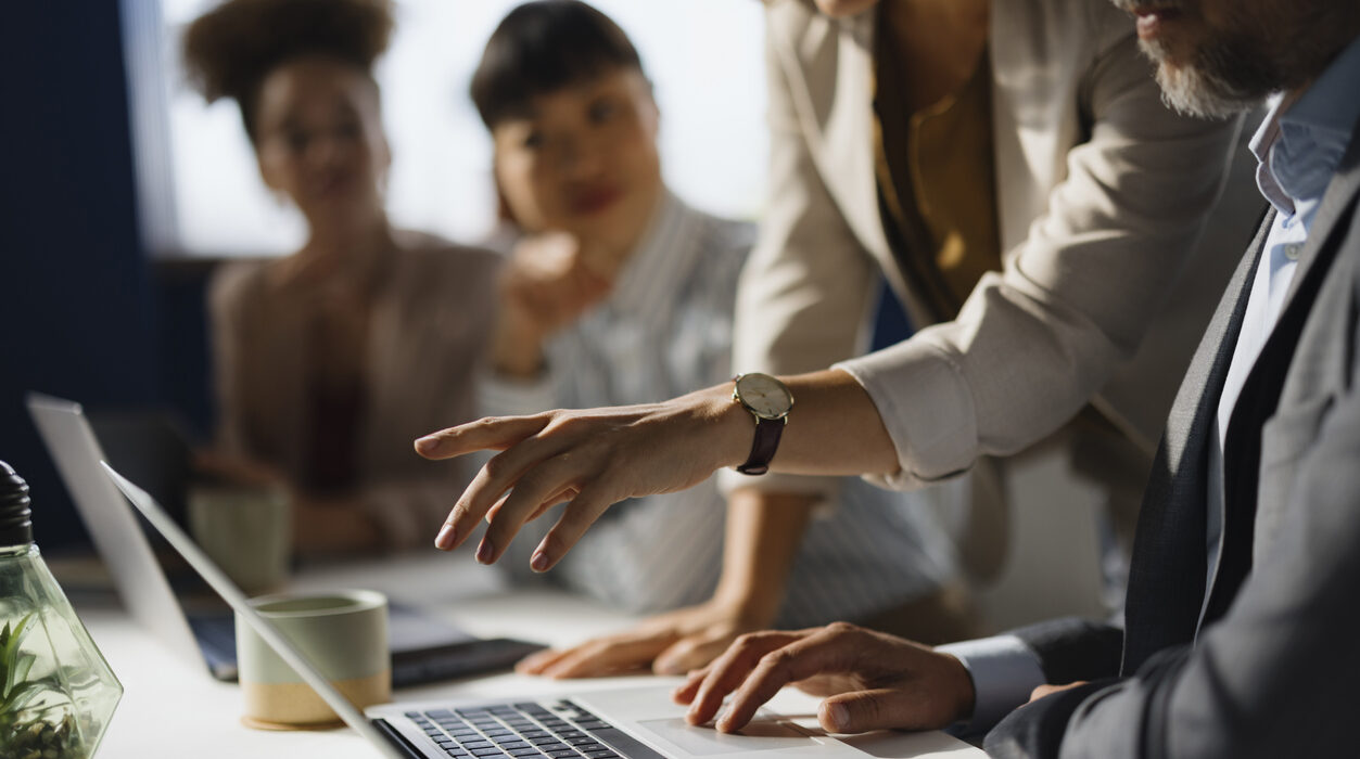 businesswoman showing her colleague an e-mail