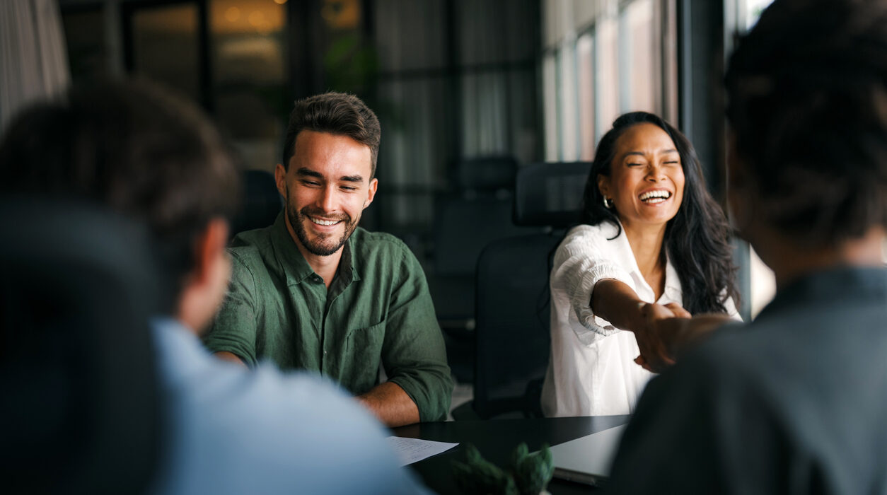 business people shaking hands in the office for a deal