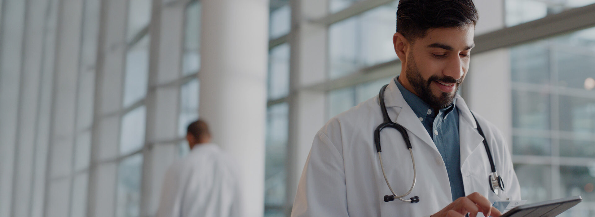 Doctor using his tablet